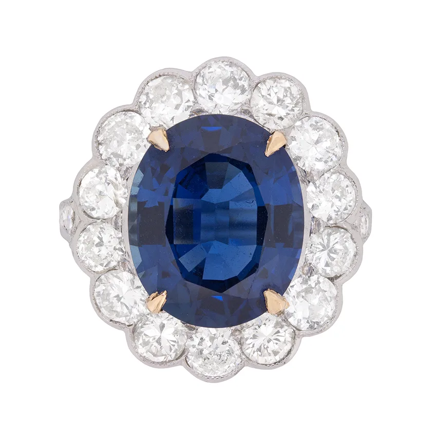 Late Deco 7.40ct Sapphire and 2.40ct Diamond Halo Ring, c.1940s