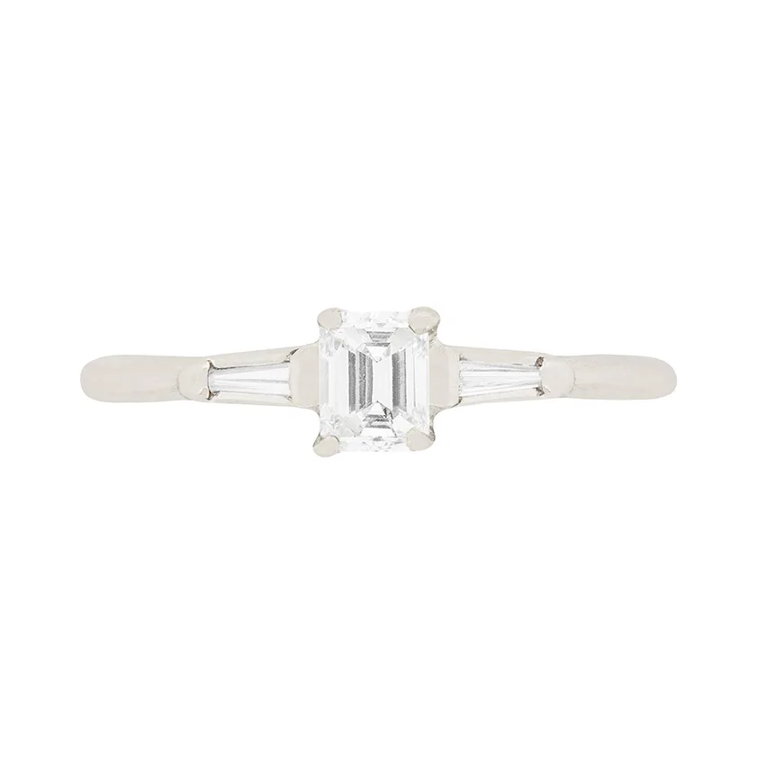 Contemporary 0.25ct Emerald Cut Diamond Engagement Ring with Tension Set Shoulders