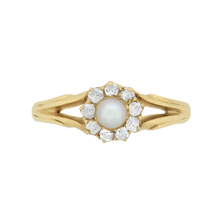 pearl ring surrounded by diamonds